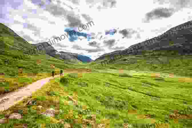 A Hiker Walking Along A Ridge In The Scottish Highlands With Lochnagar In The Background Along The Divide: Walking The Wild Spine Of Scotland