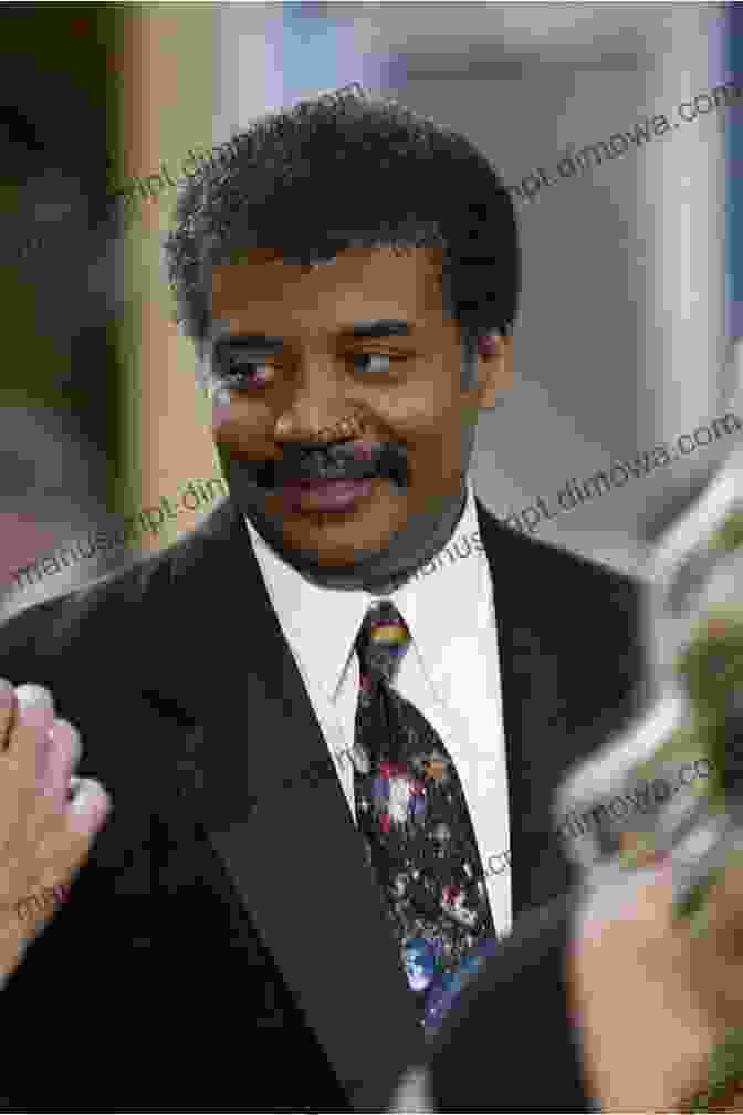 Neil DeGrasse Tyson, A Black Man With A Shaved Head And Goatee, Wearing A Black Suit And Tie, Standing In Front Of A Backdrop Of Stars And Galaxies. The End Of Everything: 5